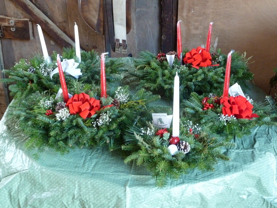 centerpieces barn display table Nutkin Knoll Farm wreaths greens